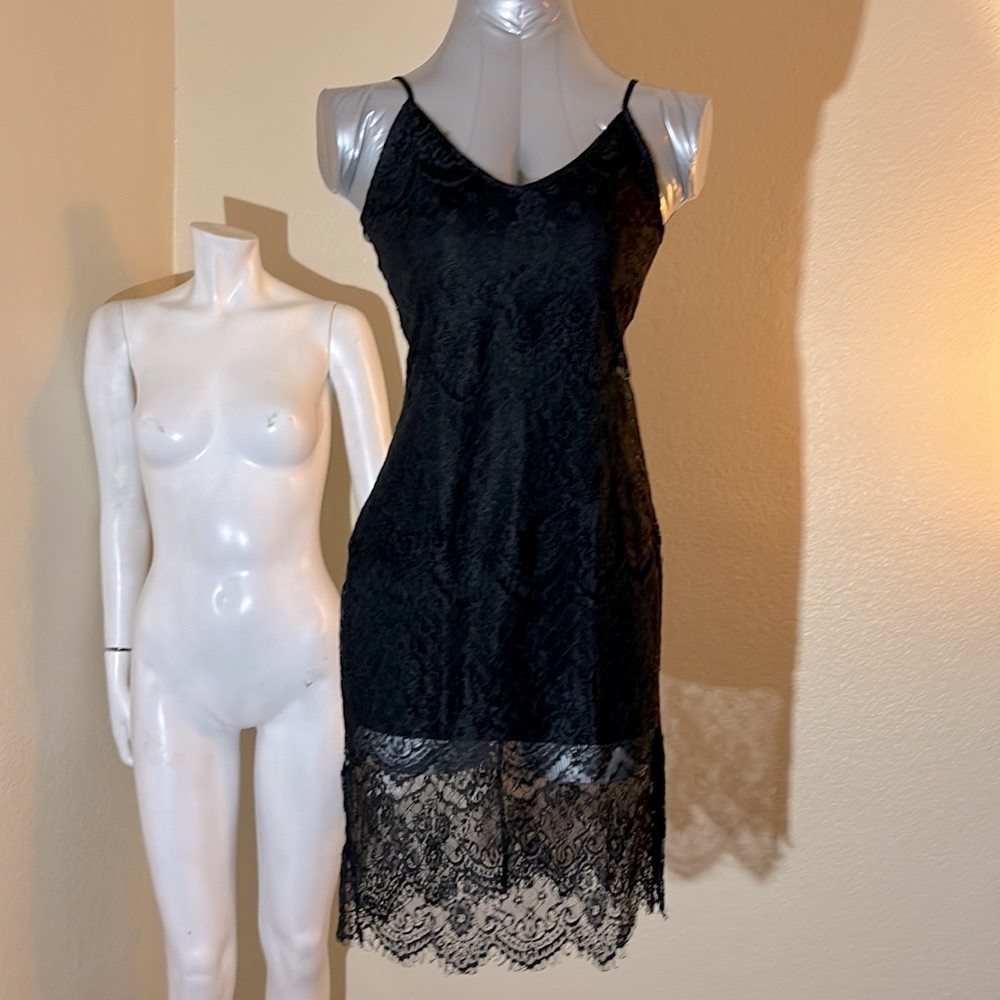 Slim black lace dress.